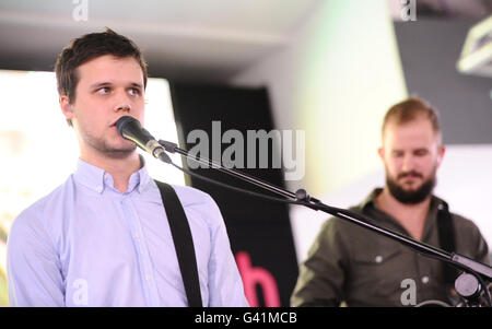 Harry McVeigh (left) and Charles Cave (right) of the White Lies playing at HMV in Oxford Street, London. Stock Photo