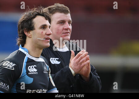 Glasgow players Bernardo Stortoni and Moray Low (right) bruised but victorious after their win over Wasps Stock Photo