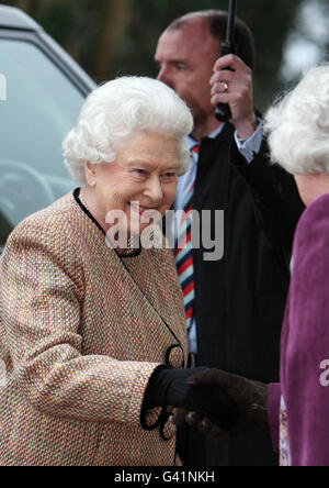 Queen Elizabeth II is greeted by WI Chairwoman Yvonne Browne, on her arrival at The Sandringham Women's Institute, at West Newton Church Hall, near Sandringham, Norfolk. Stock Photo