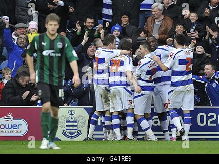 Soccer - npower Football League Championship - Queens Park Rangers v Coventry City - Loftus Road. Queens Park Rangers' Wayne Routledge celebrates with his team-mates (right) after scoring their second goal Stock Photo