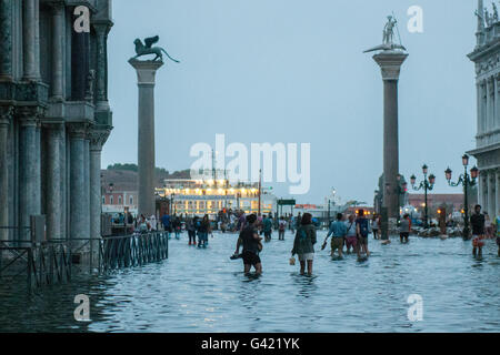 Venice, Italy. 15th June, 2016. Tourists enjoy St. Mark square during the high water on June 15, 2016 in Venice, Italy. The high water in this period is exceptional, and it is a surprise for citizen and tourists.  Credit:  Simone Padovani /Awakening/Alamy Live News Stock Photo