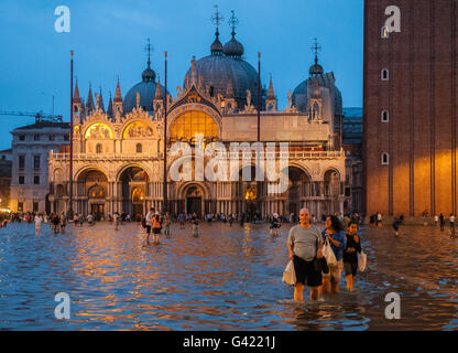 Venice, Italy. 15th June, 2016. Tourists enojoy St. Mark square during the high water on June 15, 2016 in Venice, Italy. The high water in this period is exceptional, and it is a surprise for citizen and tourists.  Credit:  Simone Padovani /Awakening/Alamy Live News Stock Photo