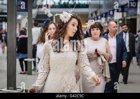 London, UK. 18th June, 2016. Racegoers in formal and fashionable dress at Waterloo Station before traveling to the final day of the Royal Ascot race meeting. Stock Photo