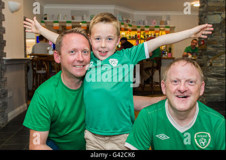 Skibbereen, West Cork, Ireland. 18th June, 2016. Ireland fans Adrian, Conor and Brendan O'Brien, all from Skibbereen, in the Eldon Hotel in Skibbereen before the Ireland Vs Belgium game in Bordeaux in the 2016 Euros. Credit: Andy Gibson/Alamy Live News. Stock Photo