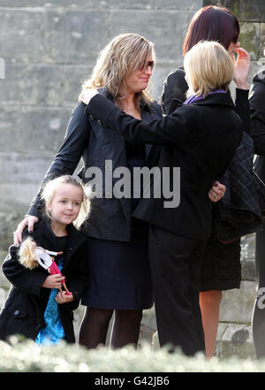 Fiancee Amanda Shields (centre left) with daughter Sophie, greets mourners after a Thanksgiving service for Malcolm Campbell at St Leonard's Parish Church in St Andrews. Stock Photo
