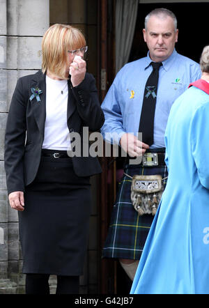 Parents Jane and Malcolm greet mourners after a Thanksgiving service for Malcolm Campbell at St Leonard's Parish Church in St Andrews. Stock Photo
