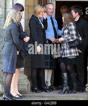 (From left to right) Fiancee Amanda Shields, sister Kerry and parents Jane and Malcolm greet mourners after a Thanksgiving service for Malcolm Campbell at St Leonard's Parish Church in St Andrews. Stock Photo