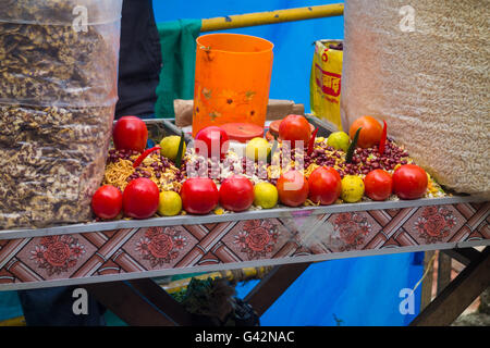 All the ingredients needed for Jhaal Muri ( Puffed Rice Snack ) arranged on table by a seller. Stock Photo