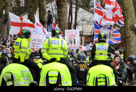 A large group of English Defence League members are watched by mounted police before marching through Luton, this afternoon. Stock Photo