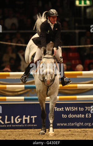 Great Britain's Tim Stockdale riding Fresh Direct K2 during the London International Horse Show at the Olympia Exhibition Centre, London. Stock Photo