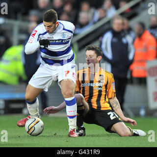 Queens Park Ranger's Adel Taarabt and Hull City's Robert Koren battle for the ball during the npower Championship match at the KC Stadium, Hull. Stock Photo