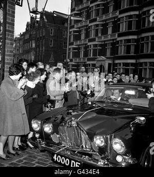 Angus Ogilvy, driving a jaguar car with a badly-damaged front, following a collision with a Morris Traveller, whose driver was quoted as saying 'I'll never get the damage repaired'. Ogilvy was arriving at Kensington Palace, London, before leaving with his fiancee Princess Alexandra of Kent, for a ball being given by the Queen at Windsor Castle. Stock Photo