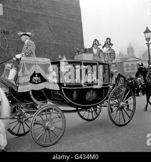 Princess Alexandra and her husband Angus Ogilvy wave to the crowd as they ride in the Glass Coach from Westminster Abbey to St James's Palace for the reception Stock Photo