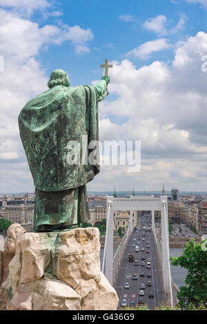 Statue of St Gellert on Gellert-hegy (hill) admonishing the traffic below on the Erzsebet Bridge in Budapest, Hungary. Stock Photo