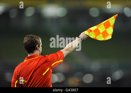 Soccer - Carling Nations Cup - Northern Ireland v Scotland - Aviva Stadium. An assistant referee flags for offside Stock Photo