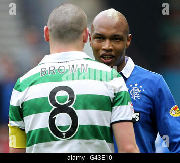 Rangers' El-Hadji Diouf and Celtic's Scott Brown (left) during the Scottish Cup Fifth Round match at Ibrox Stadium, Glasgow. Stock Photo