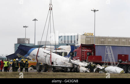 The wreckage of the Manx2 plane in which six people where killed in a crash yesterday is removed from the runway at Cork Airport. Stock Photo