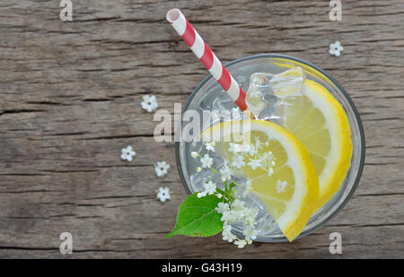 Elder lemonade with ice on old table wood Stock Photo