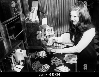 Miss Lorna Harwood, 22, one of the bank cashiers who will be among the first to deal with the changeover to a decimal currency. Stock Photo