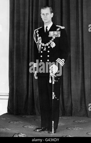 The Duke of Edinburgh, in the Throne Room of Buckingham Palace, London after he and the Queen had returned from her first State Opening of Parliament. Stock Photo