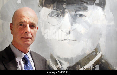 Former Head of MI6 Sir John Scarlett with paintings from ' A year with MI6' at the Mount Street Gallery in London. Stock Photo