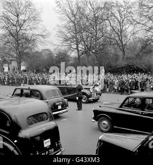 Mall traffic is brought to a standstill as the car carrying Princess Alexandra of Kent and her husband Angus Ogilvy sweeps out from St James's Palace, London, en route for Heathrow Airport and the honeymoon flight to Scotland. Stock Photo