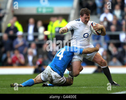 England's Dylan Hartley is tackled by Italy's Andrea Masi during the RBS 6 Nations match at Twickenham, London. Stock Photo