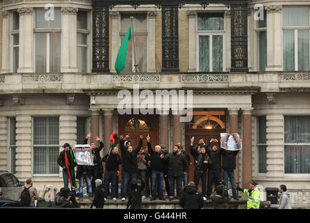 Protesters gather outside the Libyan Embassy at No 15 Knightsbridge, west London. Stock Photo