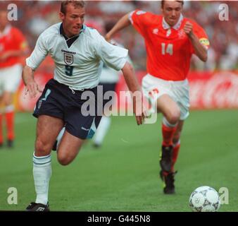 Holland's Richard Witschge chases England's Alan Shearer for the ball during tonight's (Tue) Euro 96 clash at Wembley. Photo by Neil Munns/PA Stock Photo