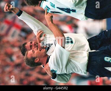 Teddy Sheringham celebrates with Alan Shearer (left) after scoring England's second goal in tonight's (Tues) Euro 96 clash against Holland at Wembley. Photo by Adam Butler/PA Stock Photo