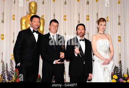 ** Trent Reznor and Atticus Ross with the Best Original Score award, received for The Social Network, with Hugh Jackman and Nicole Kidman at the 83rd Academy Awards at the Kodak Theatre, Los Angeles. Stock Photo