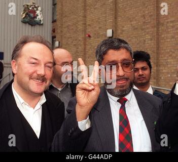 Saudi Arabian dissident Professor Muhammad Al-Mass'ari (right), with George Galloway (left), celebrates outside the Immigration Appellate Authority, north London, after an appeal hearing judge told Home Secretary Michael Howard to reconsider the case. Judge David Pearl, ruling on an appeal against the deportation of Professor Al-Mass-ari, decided that Mr Howard had not established that Dominica, the Caribbean island to which he was due to be expelled, was a safe third country for the dissident. Stock Photo
