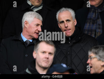 Northern Ireland Manager Nigel Worthington (left) and Wolves manager Mick McCarthy in the stands during the npower Championship match at the City Ground, Nottingham. Stock Photo