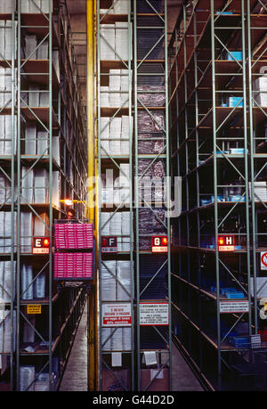 Automated forklift - elevator working in a large distribution warehouse Stock Photo