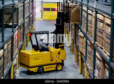 Forklift working in a large distribution warehouse Stock Photo