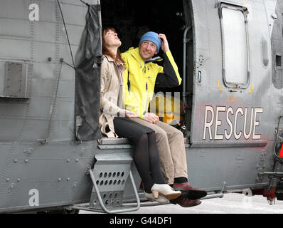 Climber Adam Potter, who survived a 1,000ft fall down Sgurr Choinnich Mor in the Nevis Range, with his partner Kate Berry during a visit to Prestwick Airport where he thanked the HMS Gannet team who rescued him. Stock Photo