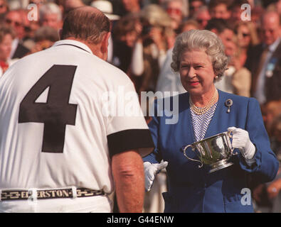 The Queen presents the Alfred Dunhill Queen's Cup to Australian media magnate Kerry Packer after his Ellerston White polo team beat Alcatel at Smith's Lawn, Windsor, today (Sunday). Photo by John Stillwell/PA