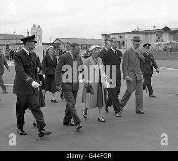 King Gustav and Queen Louise of Sweden accompanied by the Duke of Edinburgh, who saw them off, as they were about to board a Scandinavian airliner for Stockholm at London Airport at the end of their state visit to Britain. Stock Photo