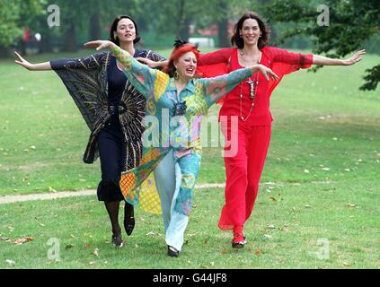 Fashion designer Zandra Rhodes (centre) is joined by models Joanne (left) and Sami (right), wearing items from her Autumn/Winter 1996 collection, at the launch today (Monday) of the 'Woman's Journal' Fashion and Beauty Shows which will be staged at The Dorchester Hotel in London over the next three days. By Neil Munns/PA. Stock Photo