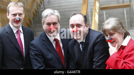 First Minister Alex Salmond (2nd right), Leader of the Scottish Labour Party Iain Gray (2nd left), Annabel Goldie Leader of the Scottish Conservative Party (right) and Tavish Scott Leader of the Scottish Liberal Democrats (left) wear red noses in support of comic relief at The Scottish Parliament in Edinburgh. Stock Photo