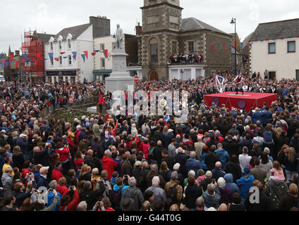 Royal Standard Bearer Rory J. Monks waves the burgh flag during a ceremony in the Selkirk's Market Place during the Selkirk Common Riding, a centuries-old tradition in the royal burgh in the Scottish Borders. Stock Photo