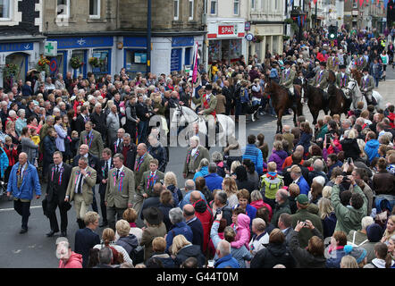 Royal Standard Bearer Rory J. Monks (centre on white horse) leads riders taking part in the Selkirk Common Riding, a centuries-old tradition in the royal burgh of Selkirk in the Scottish Borders. Stock Photo