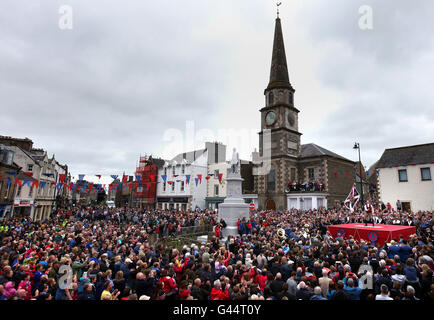 Royal Standard Bearer Rory J. Monks waves the burgh flag during a ceremony in the Selkirk's Market Place during the Selkirk Common Riding, a centuries-old tradition in the royal burgh in the Scottish Borders. Stock Photo