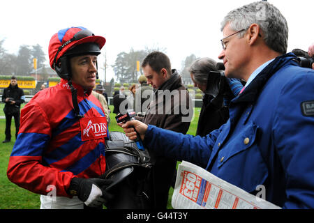 Jockey Barry Geraghty is interviewed after victory on Sprinter Sacre in theTrisoft 'National Hunt' Novices' Hurdle Stock Photo