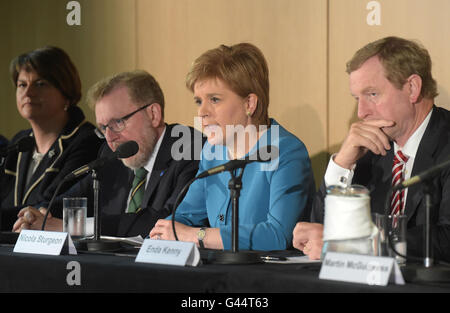 First Minister of Scotland Nicola Sturgeon, alongside David Mundell, Secretary of State for Scotland (left) and Taoiseach Enda Kenny (right) speaks to the press during the British-Irish Council Summit meeting hosted by the Scottish Government in Glasgow. Stock Photo