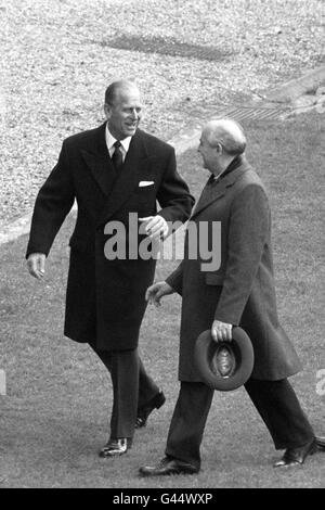 The Duke of Edinburgh (left) in animated conversation with Soviet President Mikhail Gorbachev at Windsor Castle after the visiting leader inspected the Guard of Honour in the Quadrangle. Stock Photo