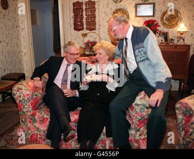 Prime Minister John Major takes tea as he meets Emmerdale characters Betty Eggleton and Seth Armstrong in the set of Betty's Cottage during his visit to the Yorkshire TV studios this morning (Mon). The Prime Minister, on a whistlestop pre-election visit to Yorkshire, denounced Labour and LibDem plans for constitutional reforms, saying 'it will end in tears'. See PA Story POLITICS Tory/Photo John Giles/PA. Stock Photo