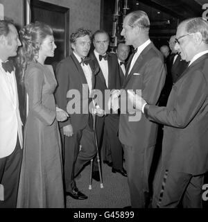 The Duke of Edinburgh talking to Prunella Ransome and actor David Hemmings at the premiere of the film 'Alfred the Great'. Stock Photo