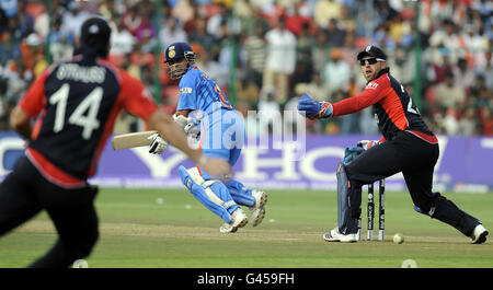 Indian batsman Sachin Tendulkar hits the ball for 4 runs during the ICC Cricket World Cup match at Chinnaswamy Stadium, Bangalore, India.