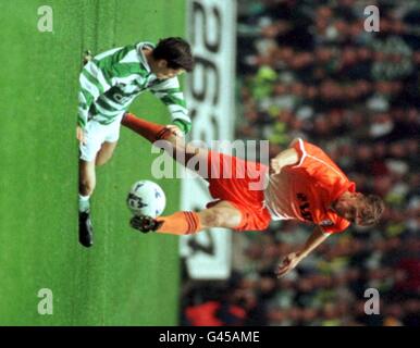 Celtic's Jackie McNamara takes a fall from Karol Prazenica of FC Kosice in the UEFA Cup Qualifying Round 2nd leg at Parkhead, Glasgow tonight (Tuesday). Photo by Chris Bacon/PA Stock Photo